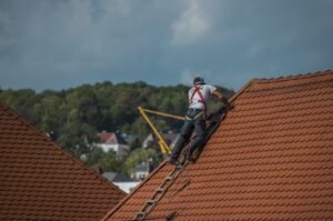 Tamanias local roofing experts fixing tiled roof