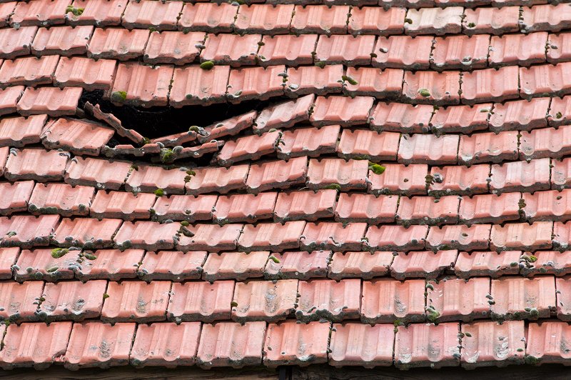 red tile roof needing to be fixed